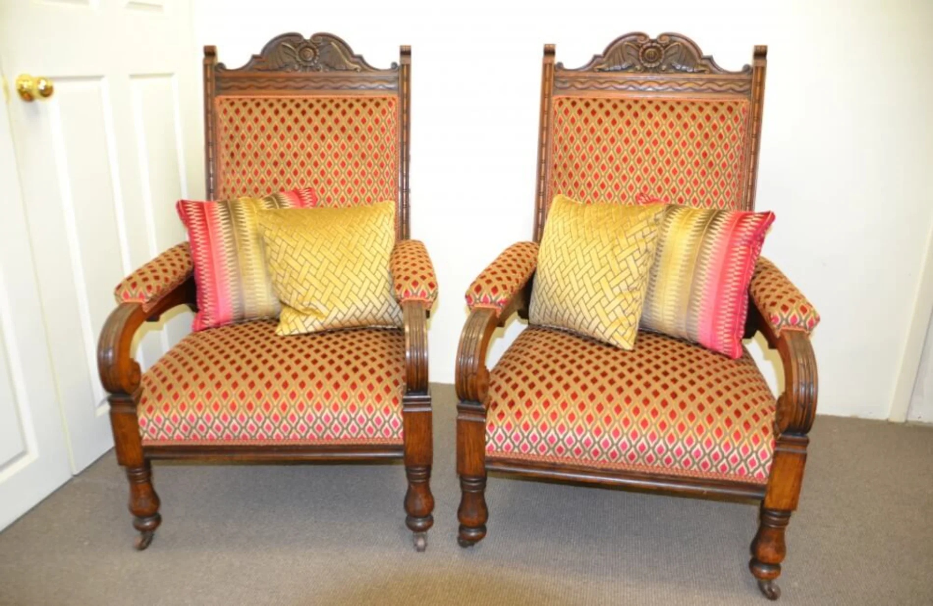 Pair of antique armchairs reupholstered in diamond-pattern fabric