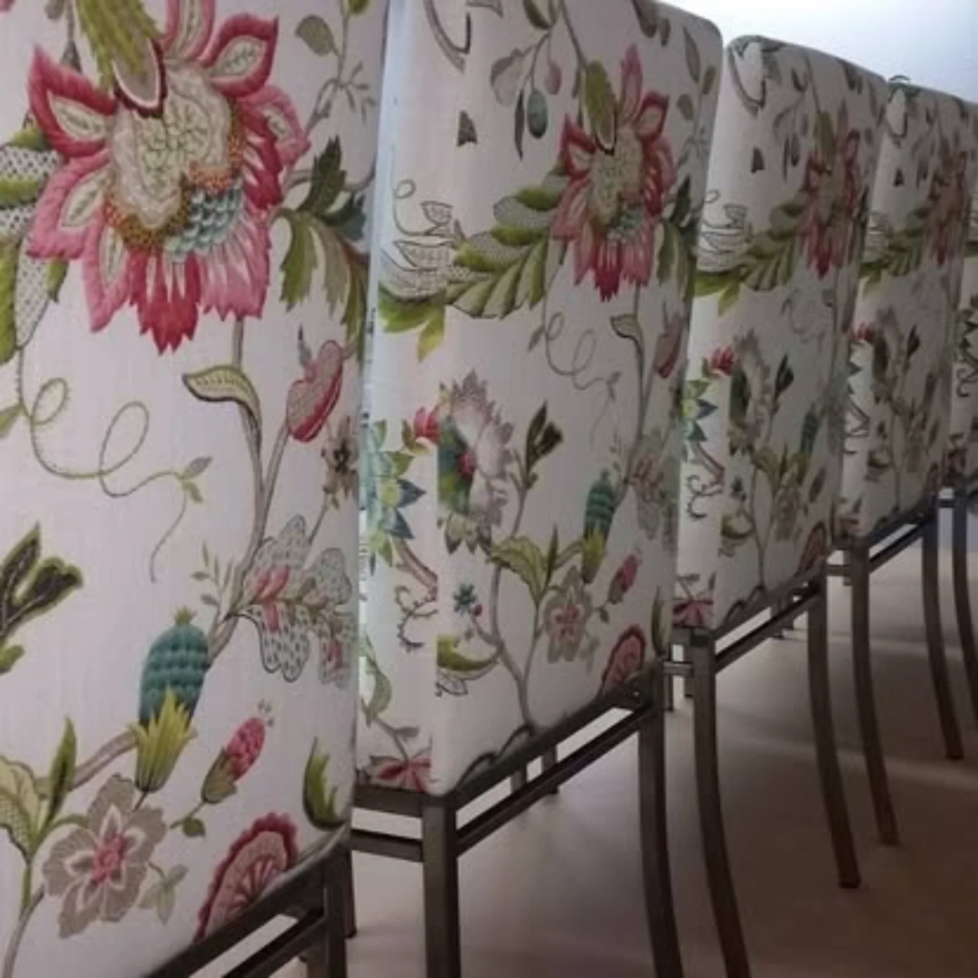 Dining chairs reupholstered in floral botanical fabric