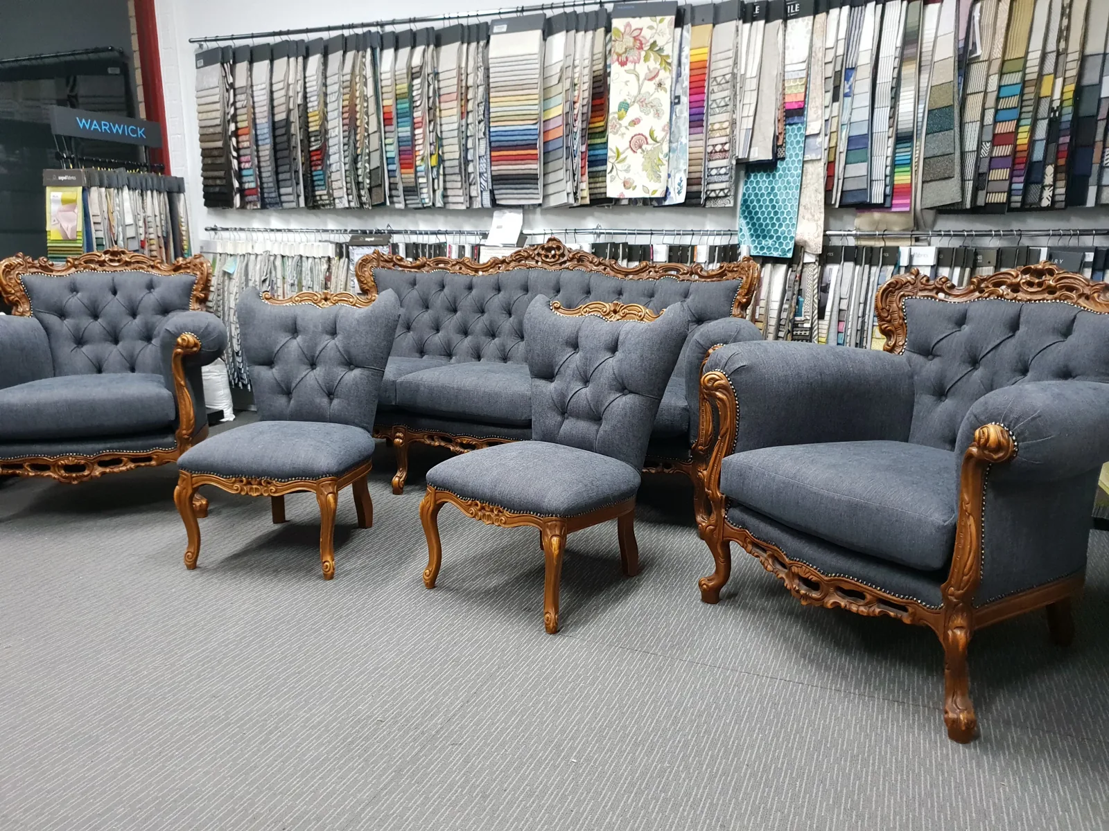 Carved timber antique lounge suite reupholstered in grey fabric